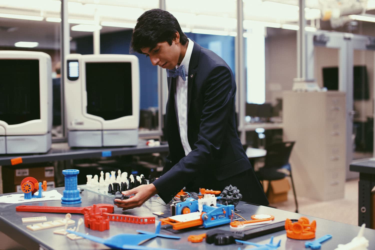 Thoughtful young man captured in a journalistic editorial portrait. His poised expression and intellectual demeanor are enhanced by soft lighting, creating a compelling image that conveys depth, curiosity, and professionalism.