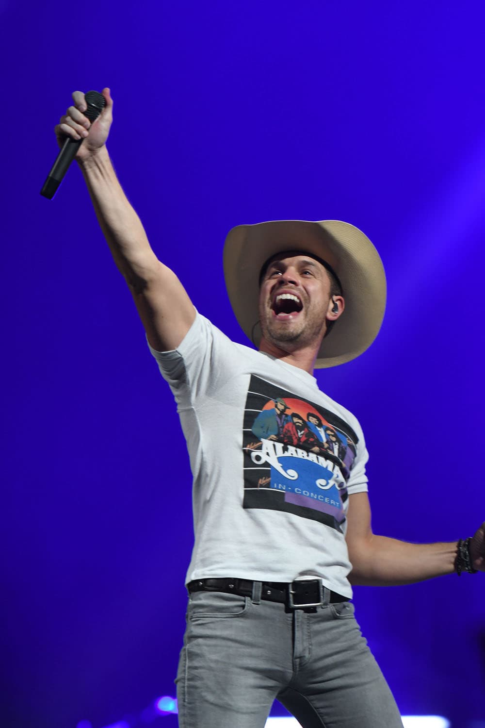 Professional country music concert photography of Dustin Lynch performing on stage. Country artist performance documentation with stage lighting and live performance energy capture.