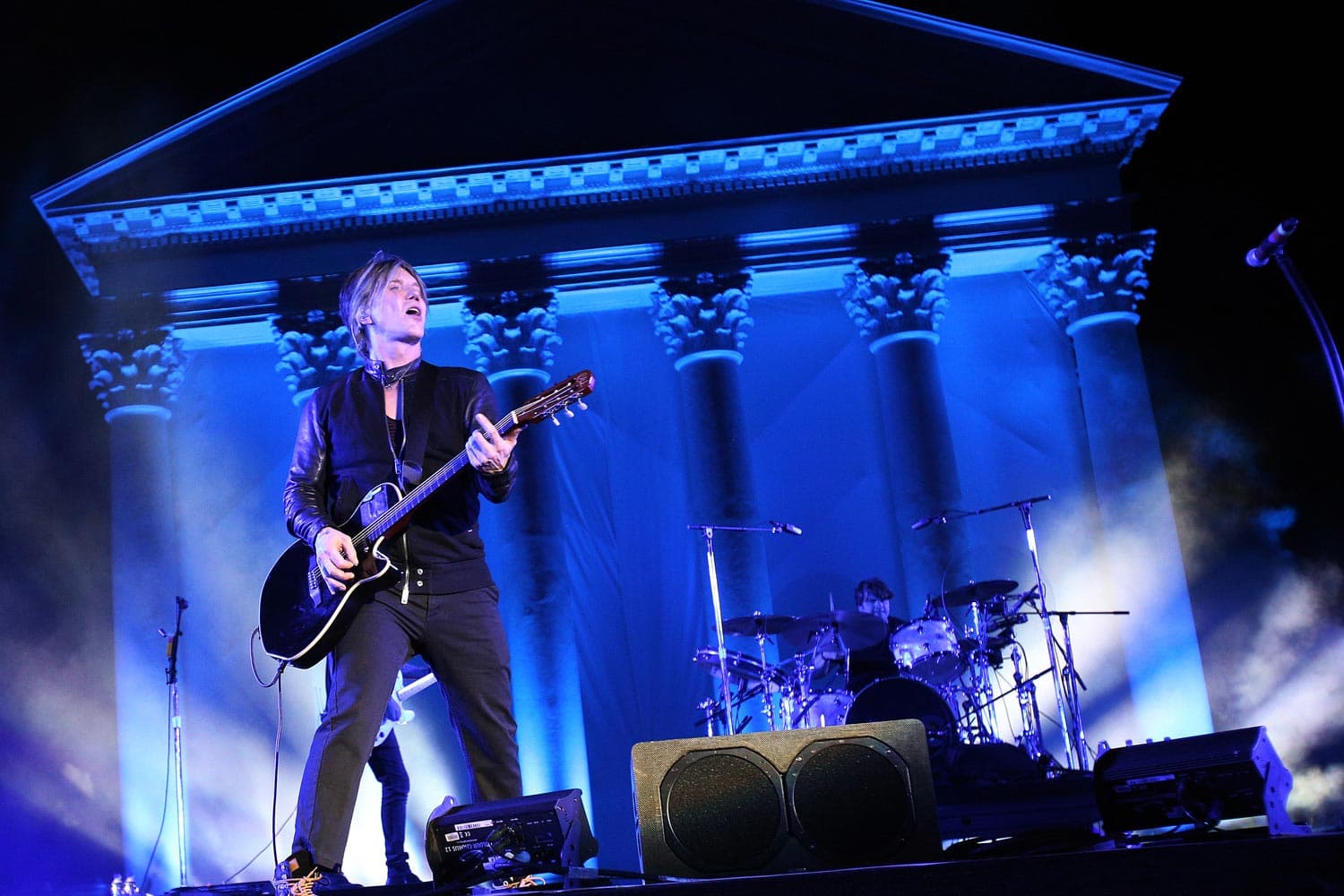Concert photography of rock frontman John Rzeznik from Goo Goo Dolls performing. Alternative rock performance capture with stage lighting and emotional vocal performance documentation.