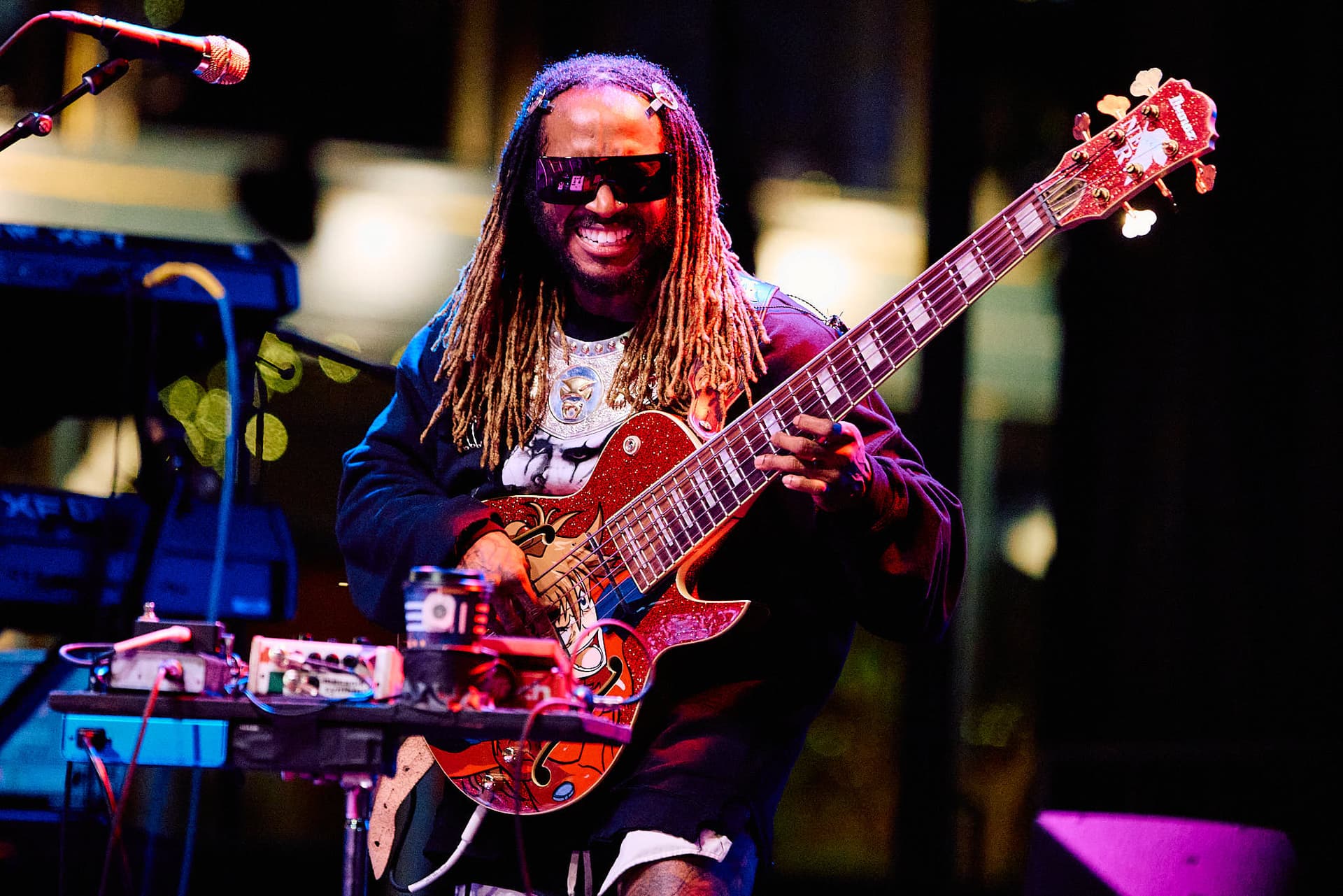 Festival concert photography of virtuoso jazz-funk bassist Thundercat performing at Capitol Hill Block Party. Complex musical performance with technical instrumentation captured through professional music photography.