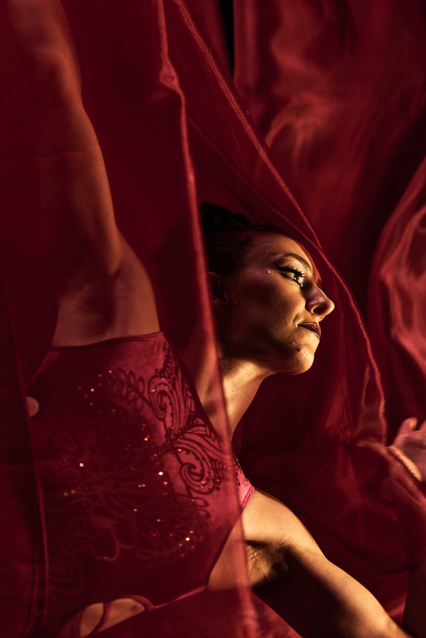 Detail-oriented commercial portrait photographer showcasing authentic creative professional imagery. Editorial headshot emphasizing personality and professional brand positioning through intentional lighting and composition.