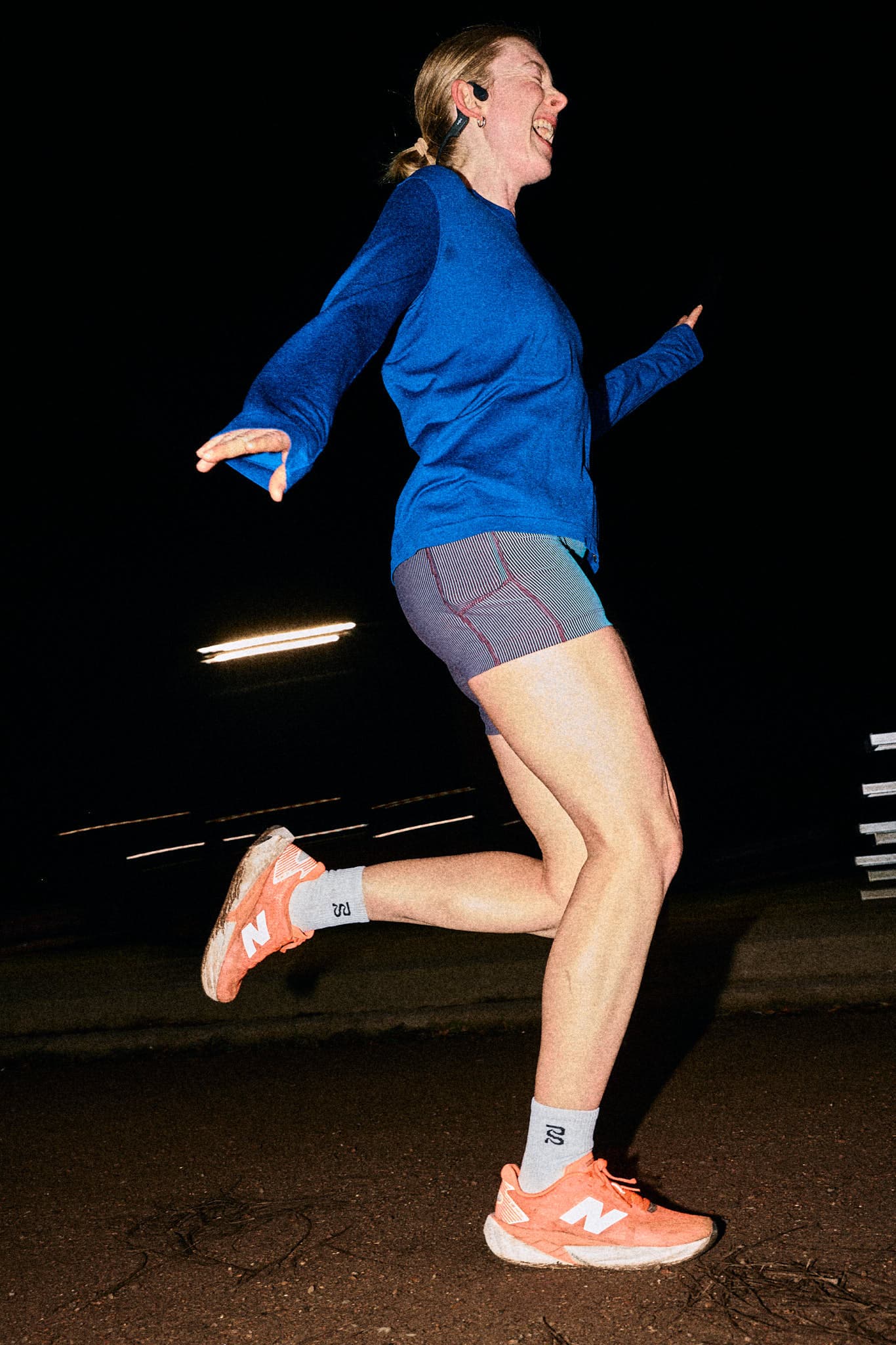 Editorial portrait of runner Madeline training on an urban route.