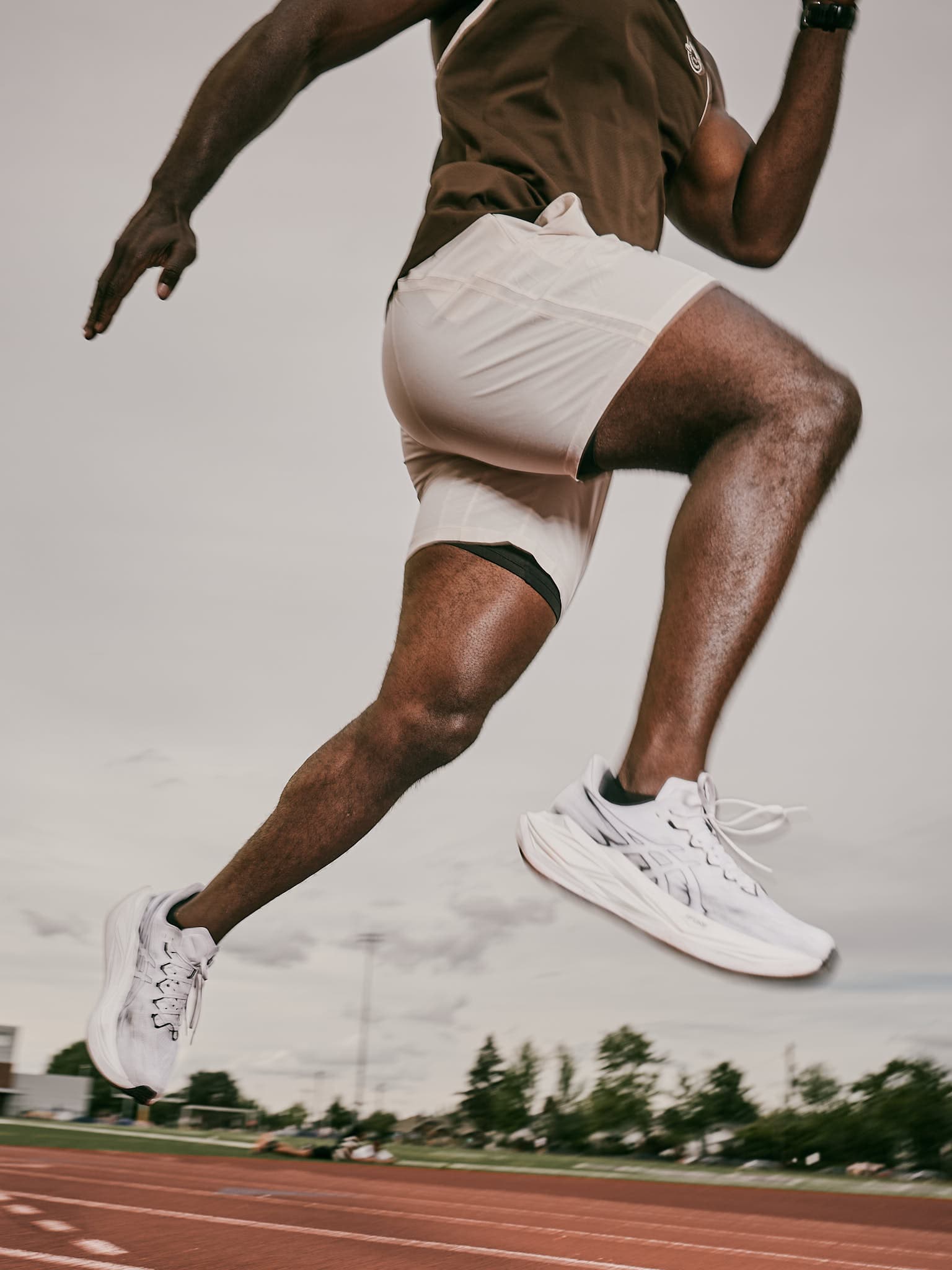 Editorial running portrait of Tobi mid-stride.