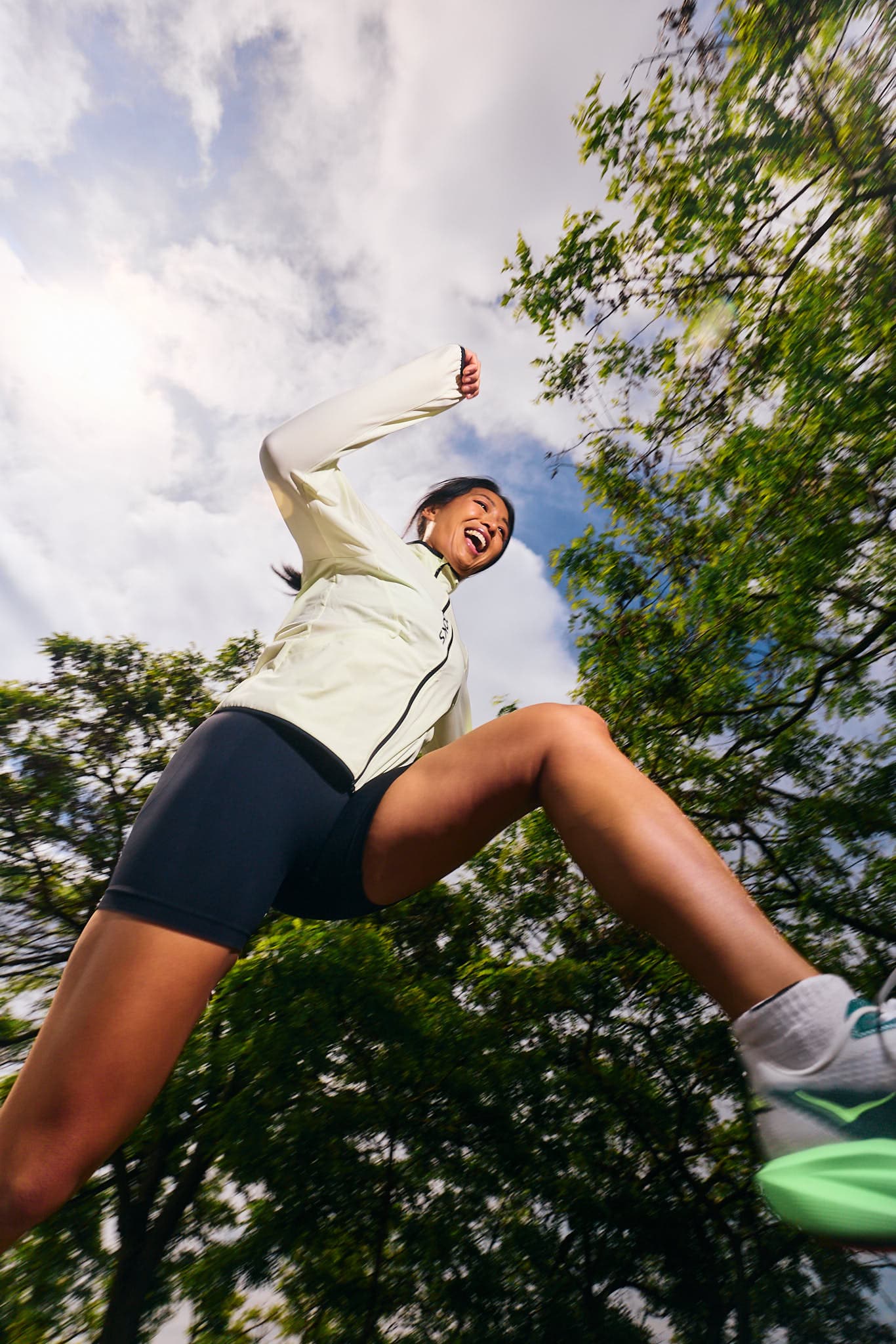Athlete Raiza jumping during a sports running editorial.