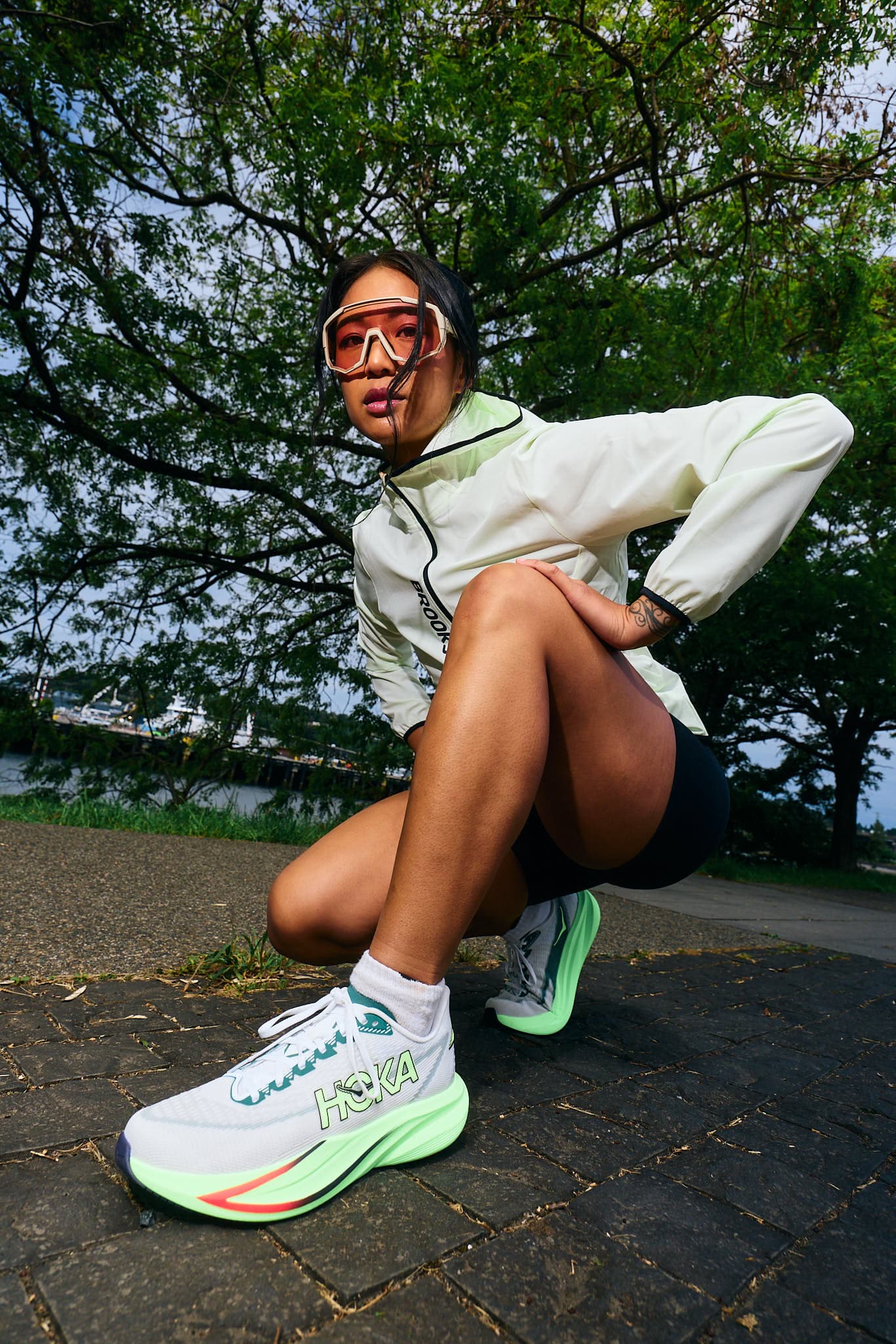 Athlete Raiza leaning forward before a sprint effort.