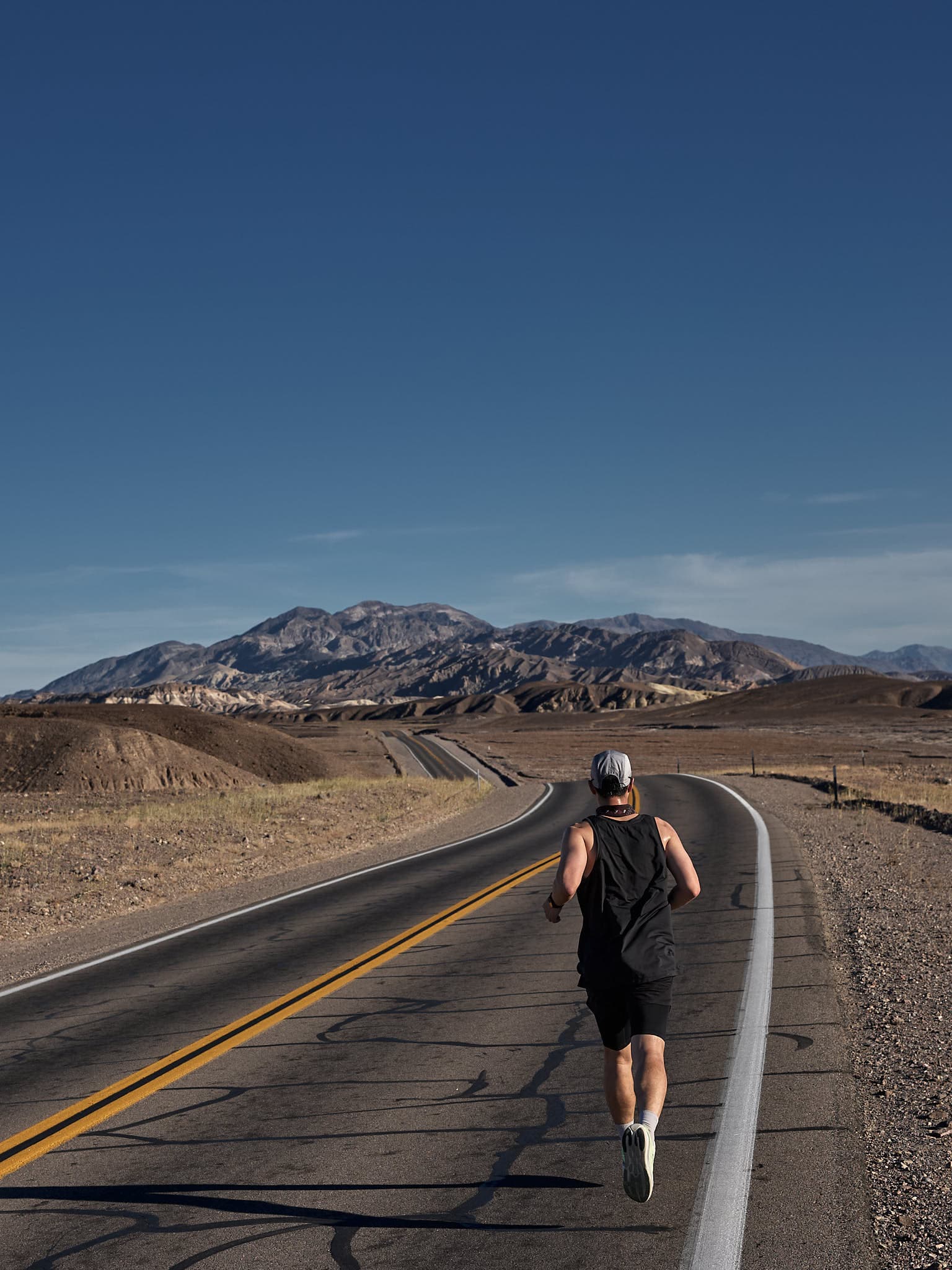 Runner Mike crossing a desert segment in The Speed Project.