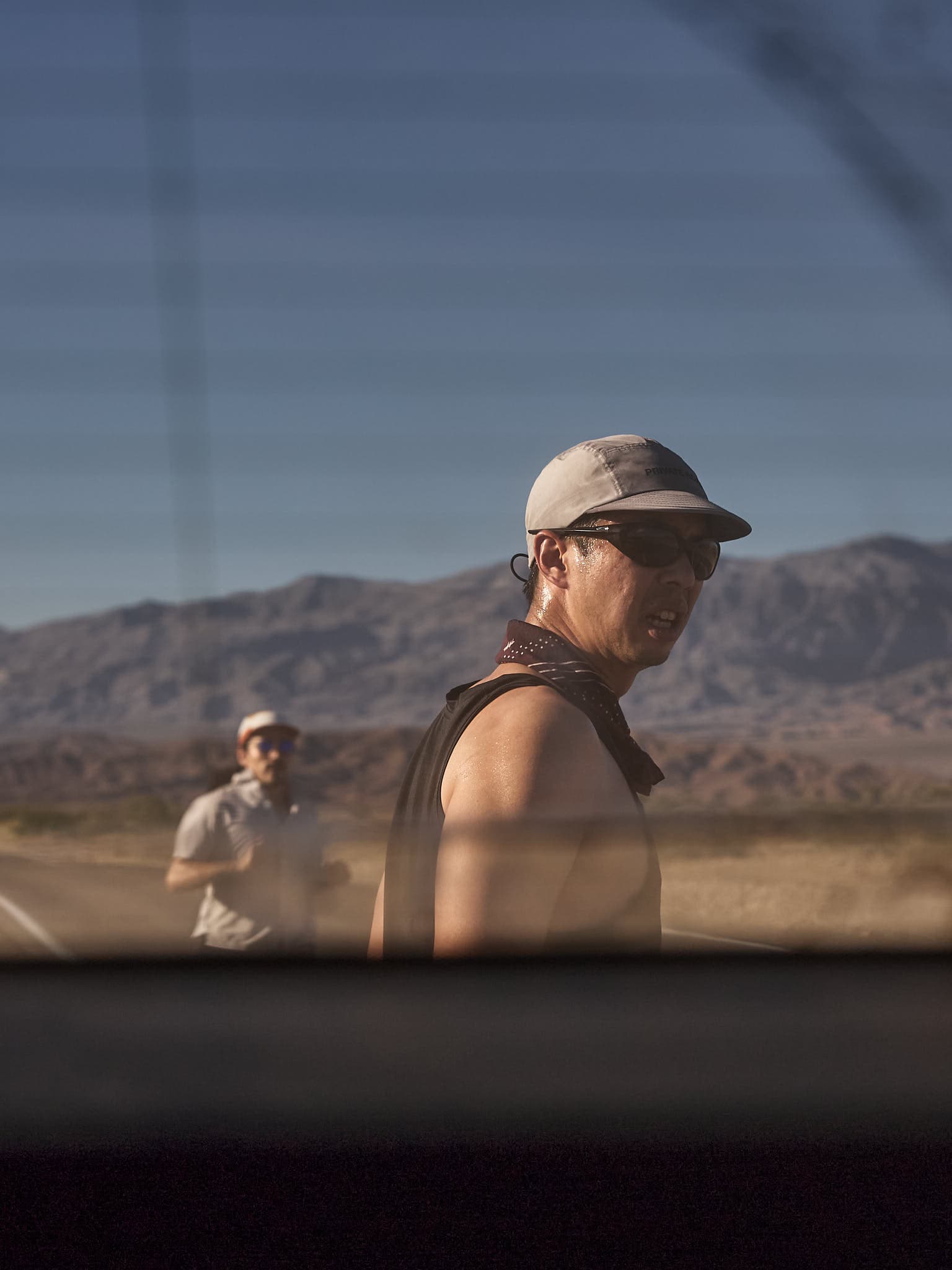 Window-view perspective of runners and route during The Speed Project.