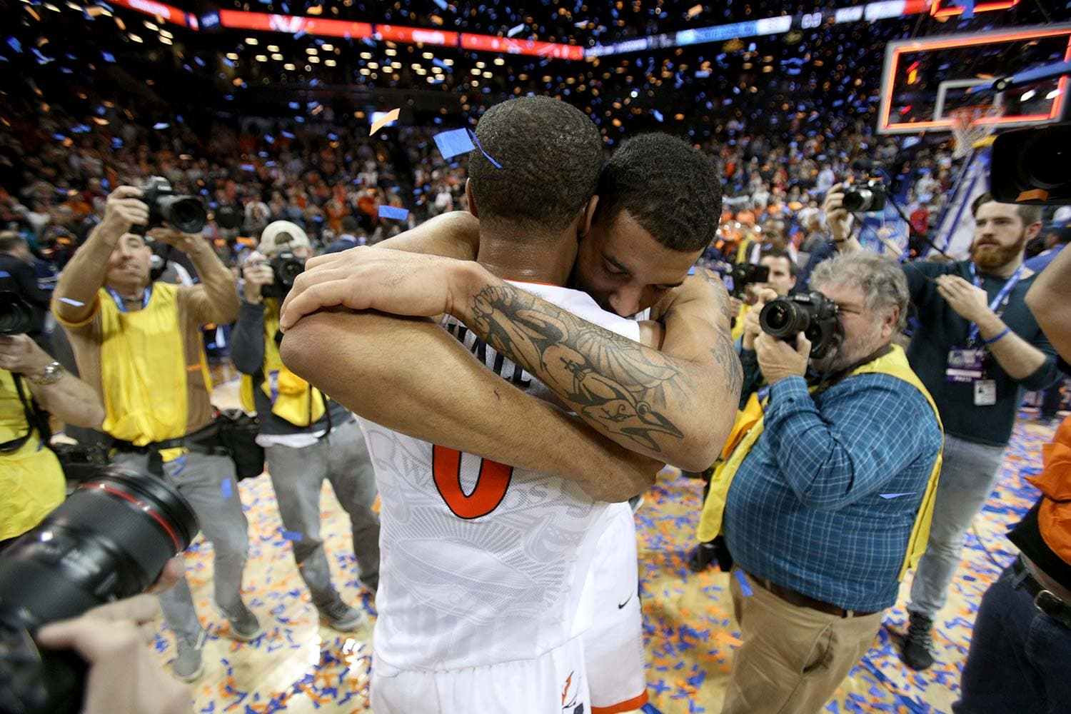 Teammates Devon Hall and Isaiah Wilkins of the Virginia Cavaliers celebrating their victory in the ACC Championship game.