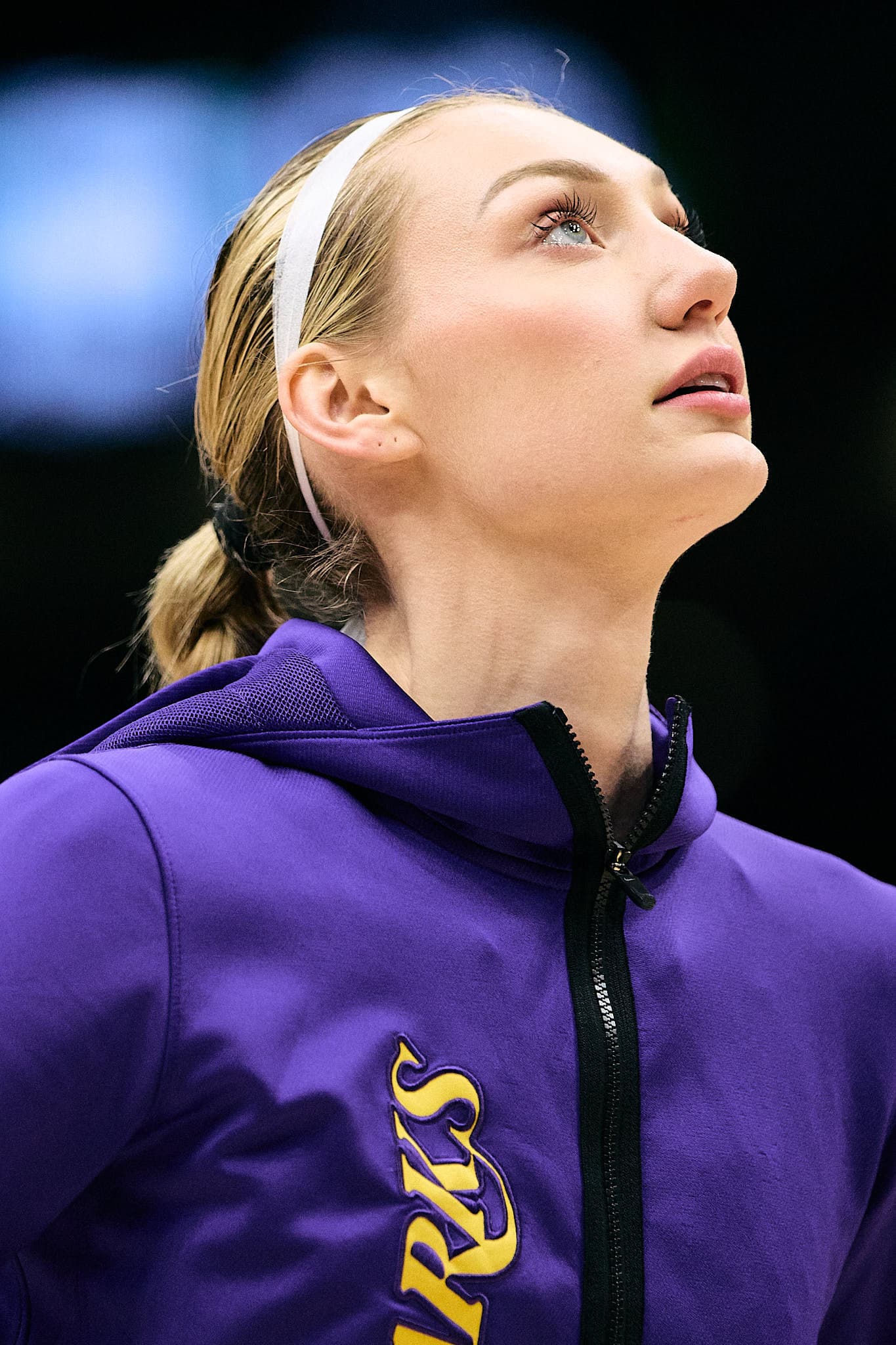 Close-up of Cameron Brink, former basketball player for the Stanford Cardinal, during pre-game action — highlighting intensity, personal style with layered earrings, and athletic poise. A compelling portrait of the Los Angeles Sparks showing professional sports excellence, ideal for promoting elite-level sports photography.